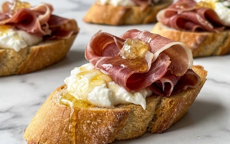 Beef Prosciutto Crostini with Burrata and Lemon Honey Drizzle